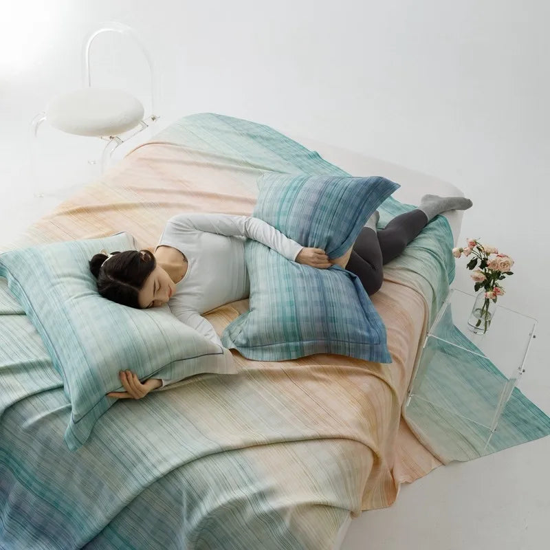 Sunset Ombre Organic Bamboo Coverlet Set - woman sleeping on bed