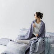 Twilight Ombre Organic Bamboo Coverlet Set - woman with coverlet over shoulders