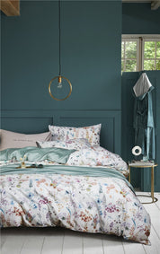 Blooming Jade Bedding Set on a bed