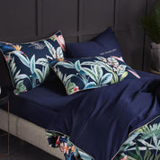 Navy Flamingo Bedding Set on a bed - angle view