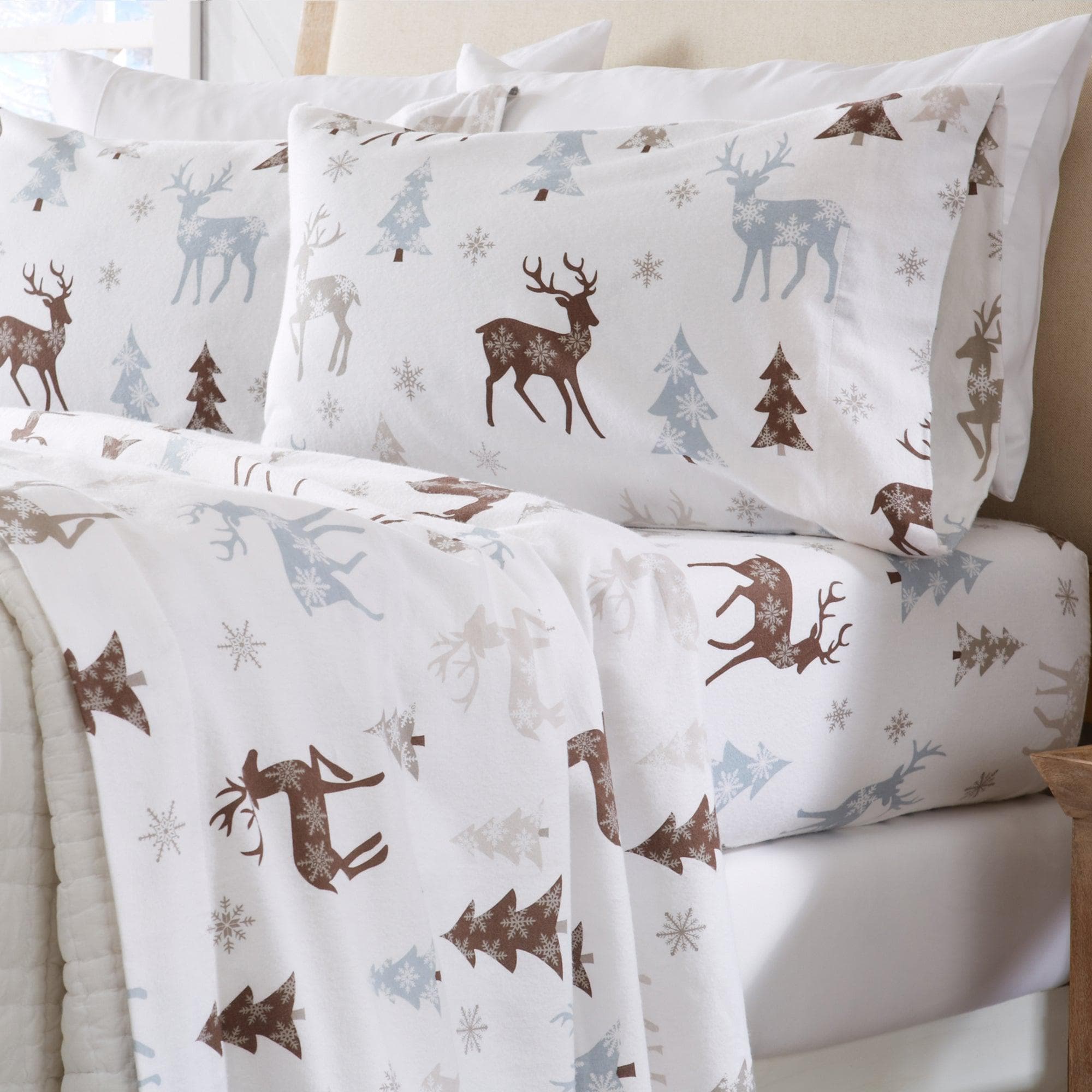 Bedding set with deer and tree pattern on a white background