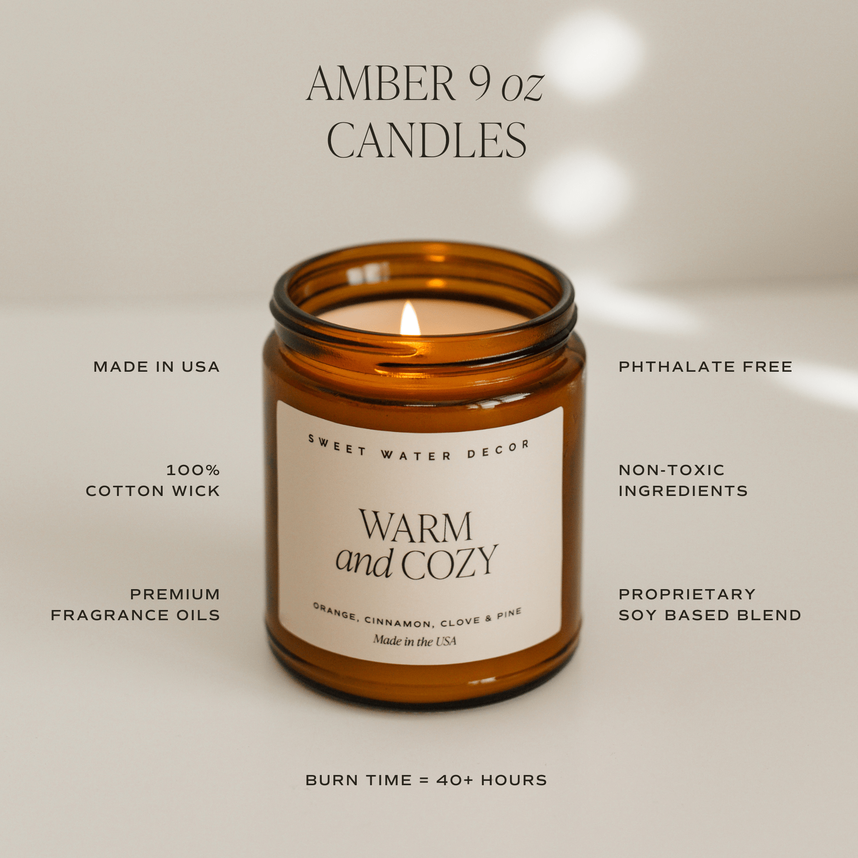 Amber 9 oz candle with 'Warm and Cozy' label on a neutral background