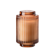Brown ribbed glass jar on a white background