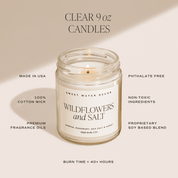Clear 9 oz candle labeled 'Wildflowers and Salt' with product details on a beige background