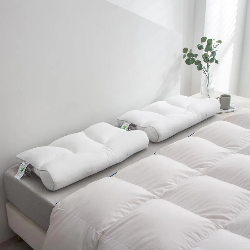 Two Contoured Pillows on Bed