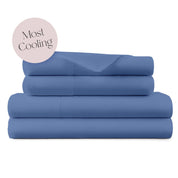 A stack of four folded blue bedding sheets or a sheet set on a white background, with a dusty pink circular badge in the upper left that reads 'Most Cooling'.