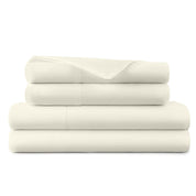 Stack of white folded towels on a white background