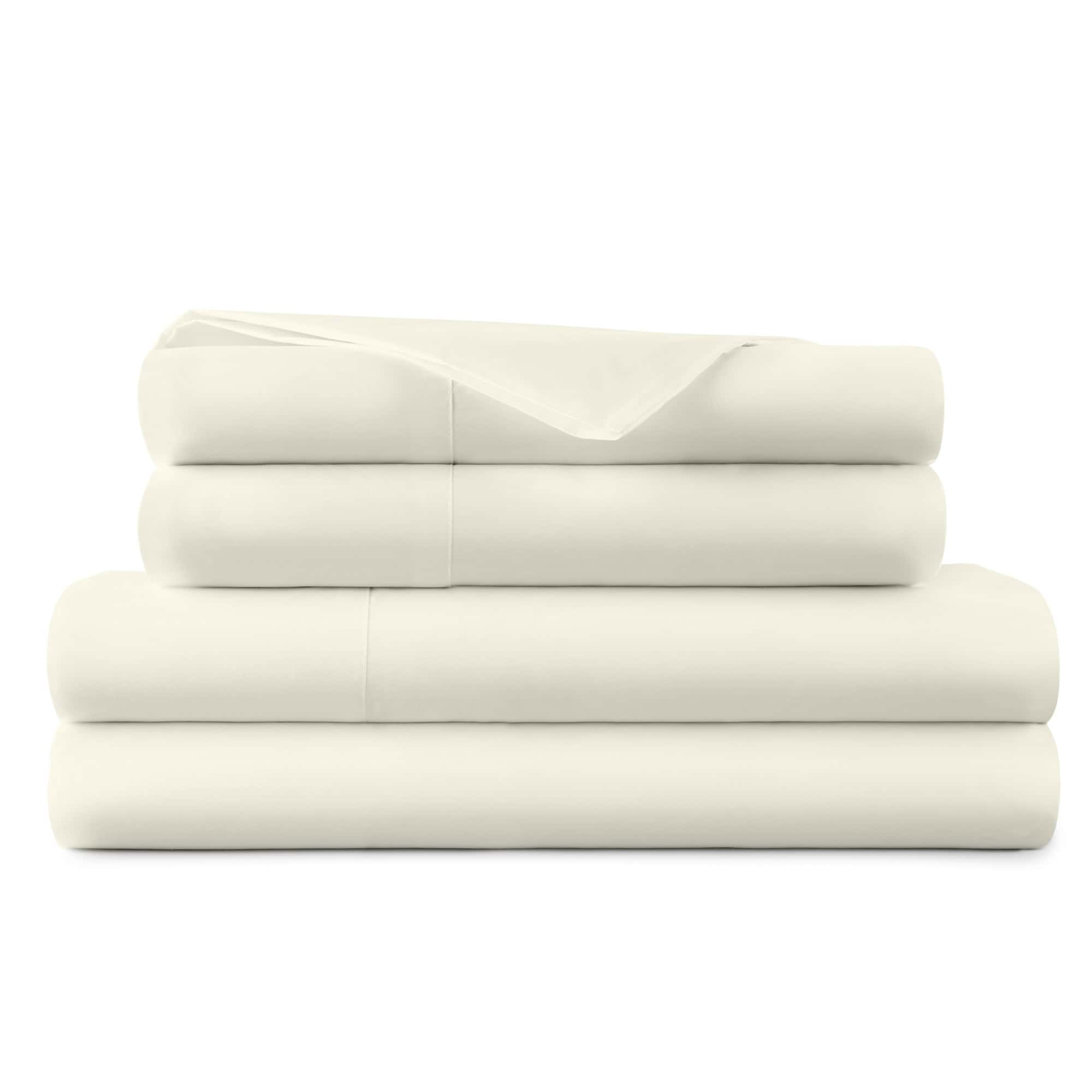 Stack of white folded towels on a white background