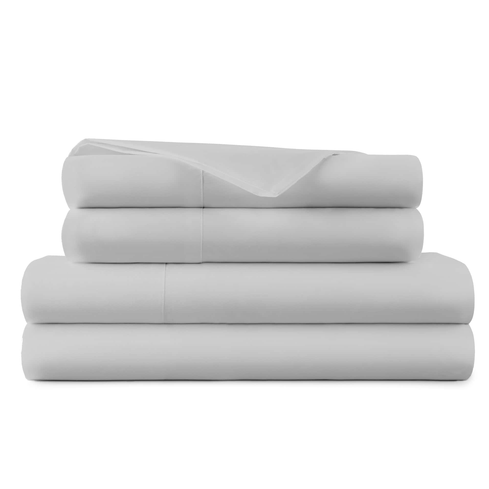 Stack of light gray folded bedding on a white background