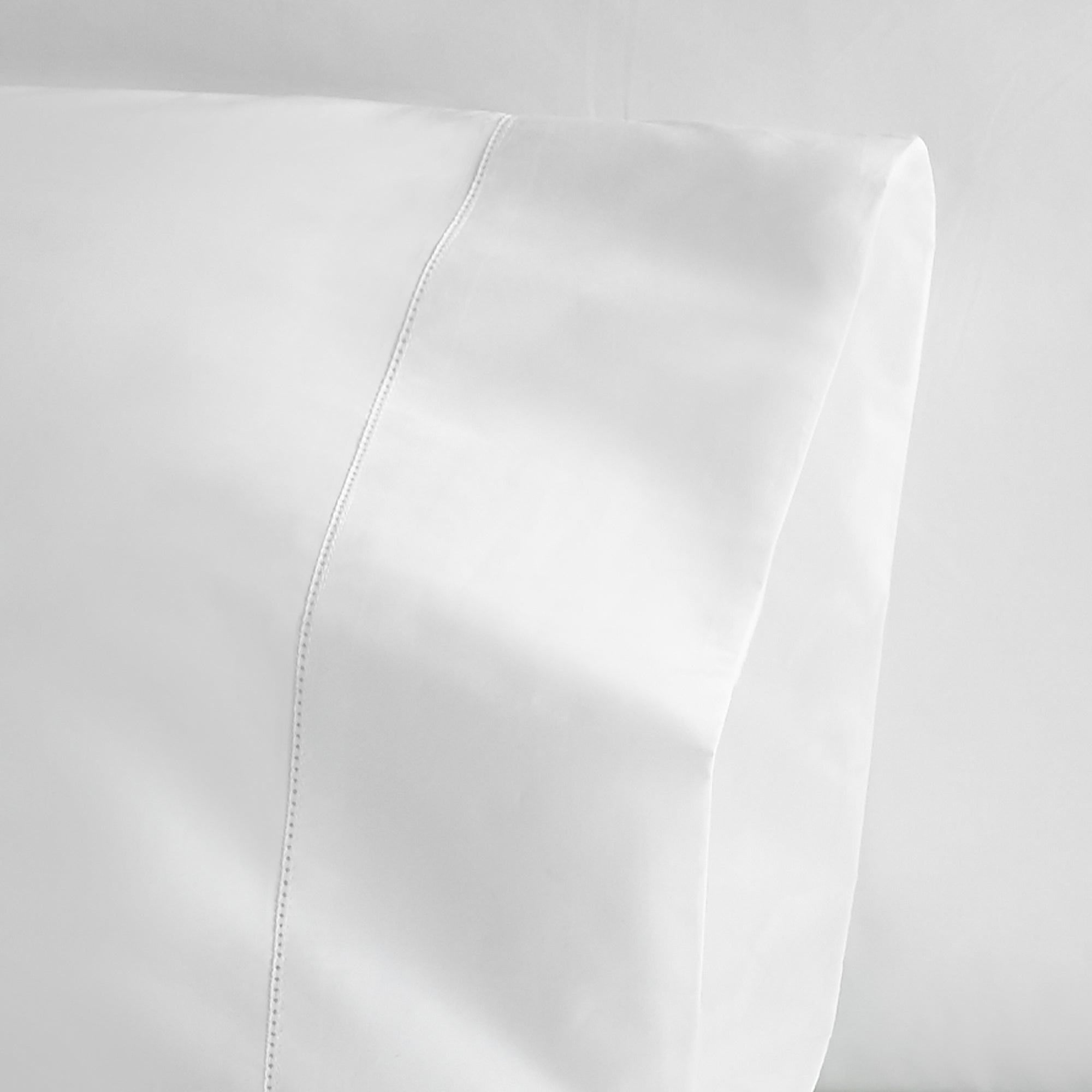 Close-up of a white leather surface with a subtle texture