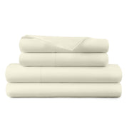 Stack of beige bed sheets on a white background