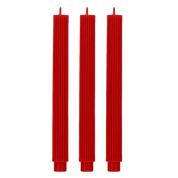 Three tall, red, ribbed taper candles standing vertically side-by-side against a solid dark green background.