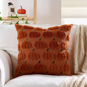Decorative pillow with pumpkin pattern on a white couch