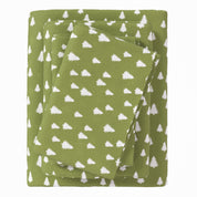 Green fabric with white tree pattern on a white background