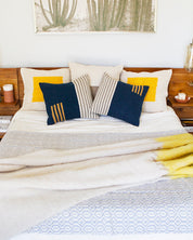 Casa Cubita Throw Blanket on Bed