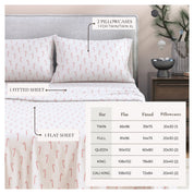 Bedding set with candy cane pattern on a bed, including flat sheet, fitted sheet, and pillowcases.