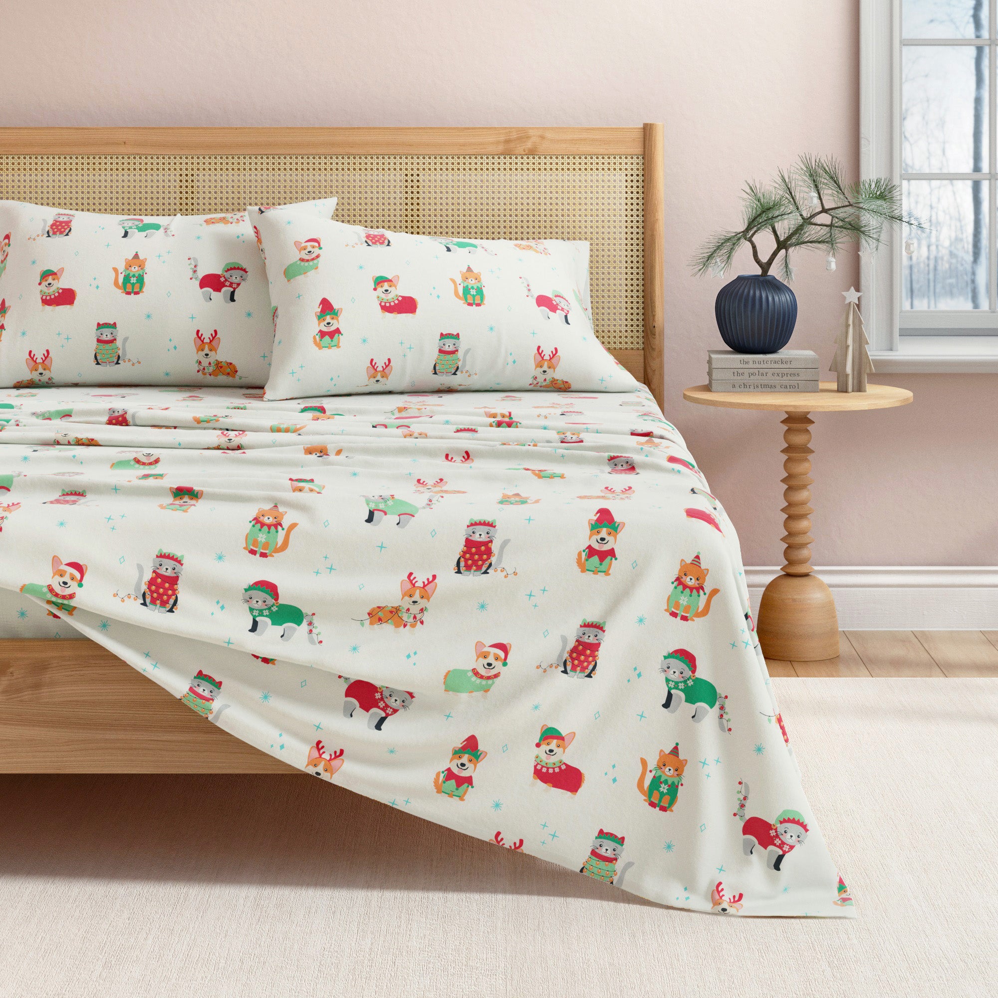 Bed with festive bedding featuring cartoon characters in a bedroom setting.
