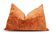 Orange and brown pillow on a white background