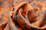 Close up of orange and brown fabric