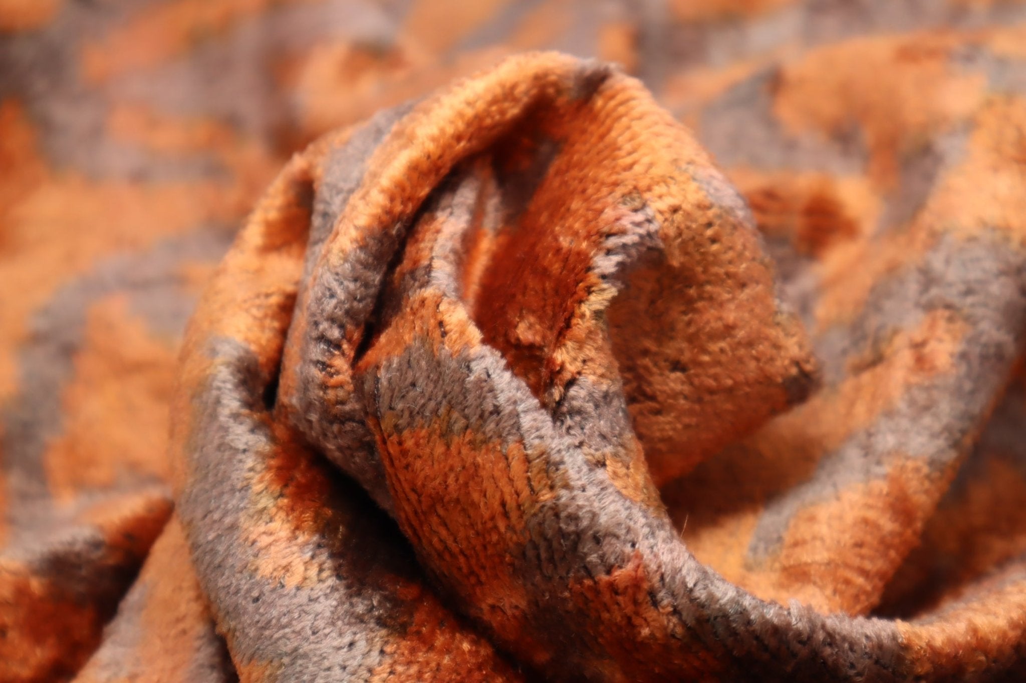 Close up of orange and brown fabric