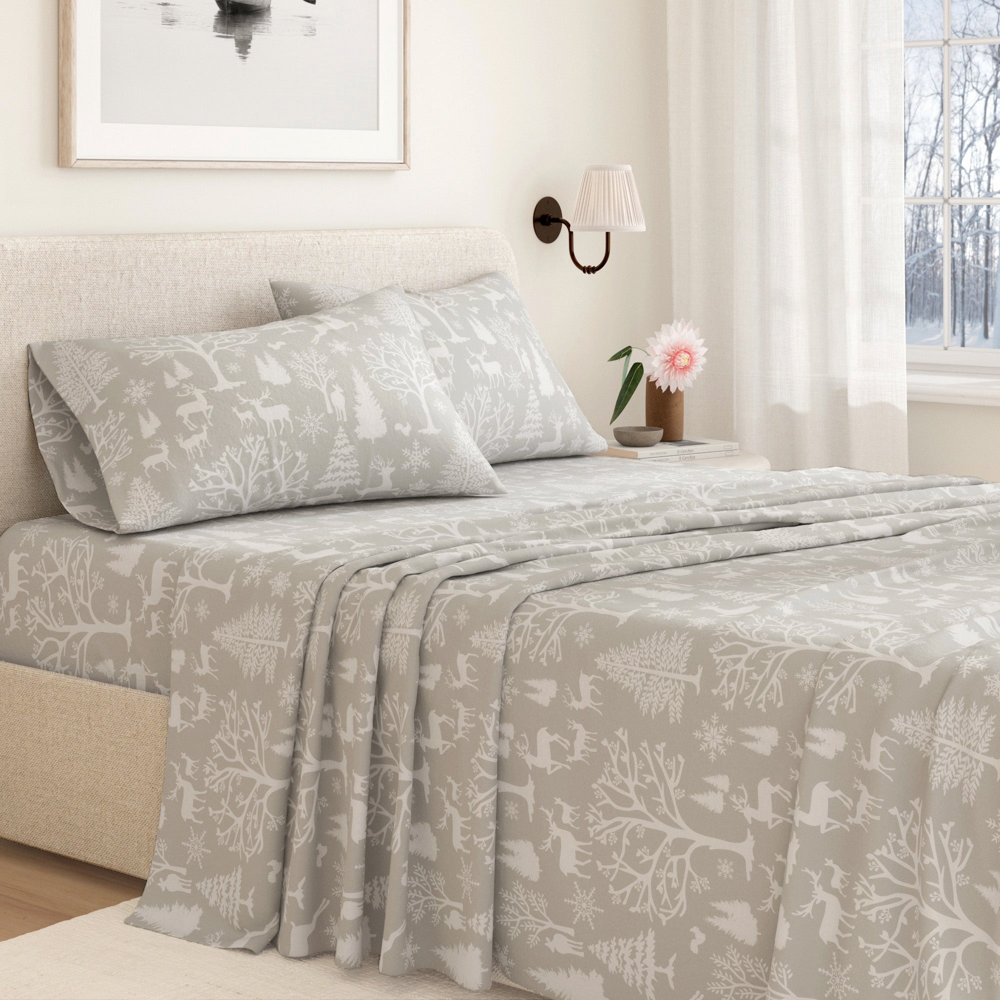 Bed with gray patterned bedding in a bedroom setting