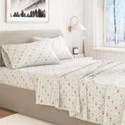 Floral patterned bedspread on a bed in a well-lit bedroom