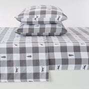 Gray and white checkered bed sheet set with bear design on a white background