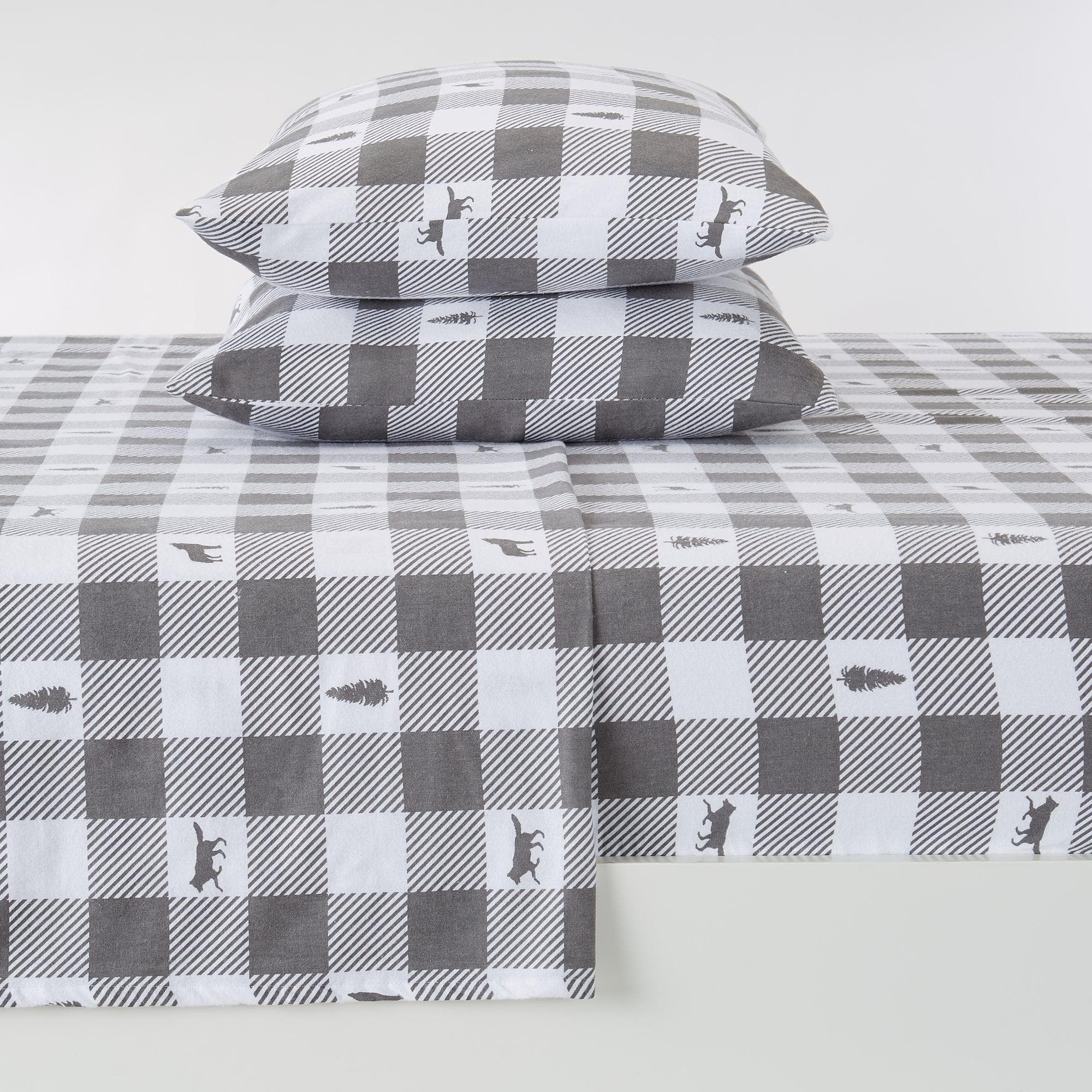 Gray and white checkered bed sheet set with bear design on a white background