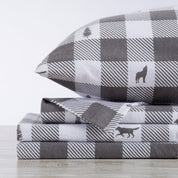 Gray and white checkered bedding set with animal icons on a light background