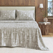 Bed with patterned bedding in a bedroom setting