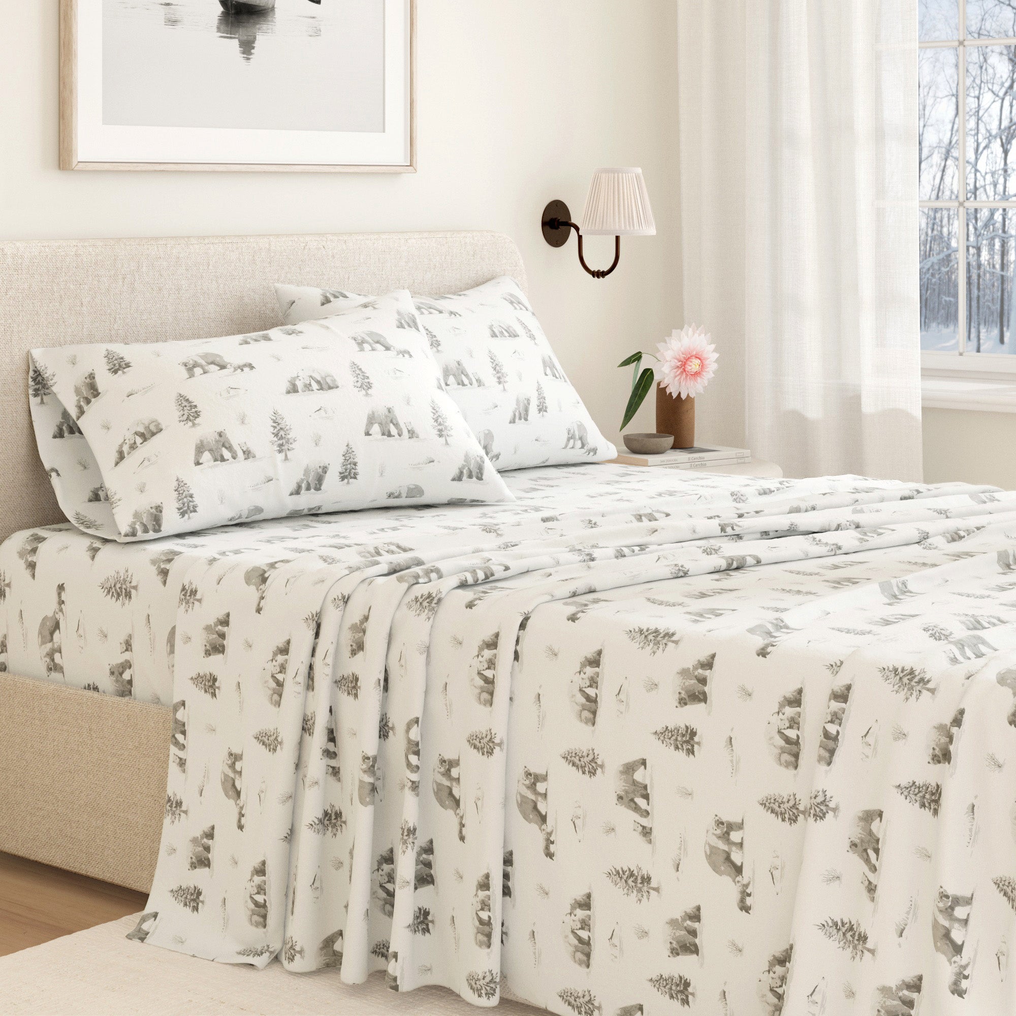 Bed with patterned bedding and pillows in a bedroom setting