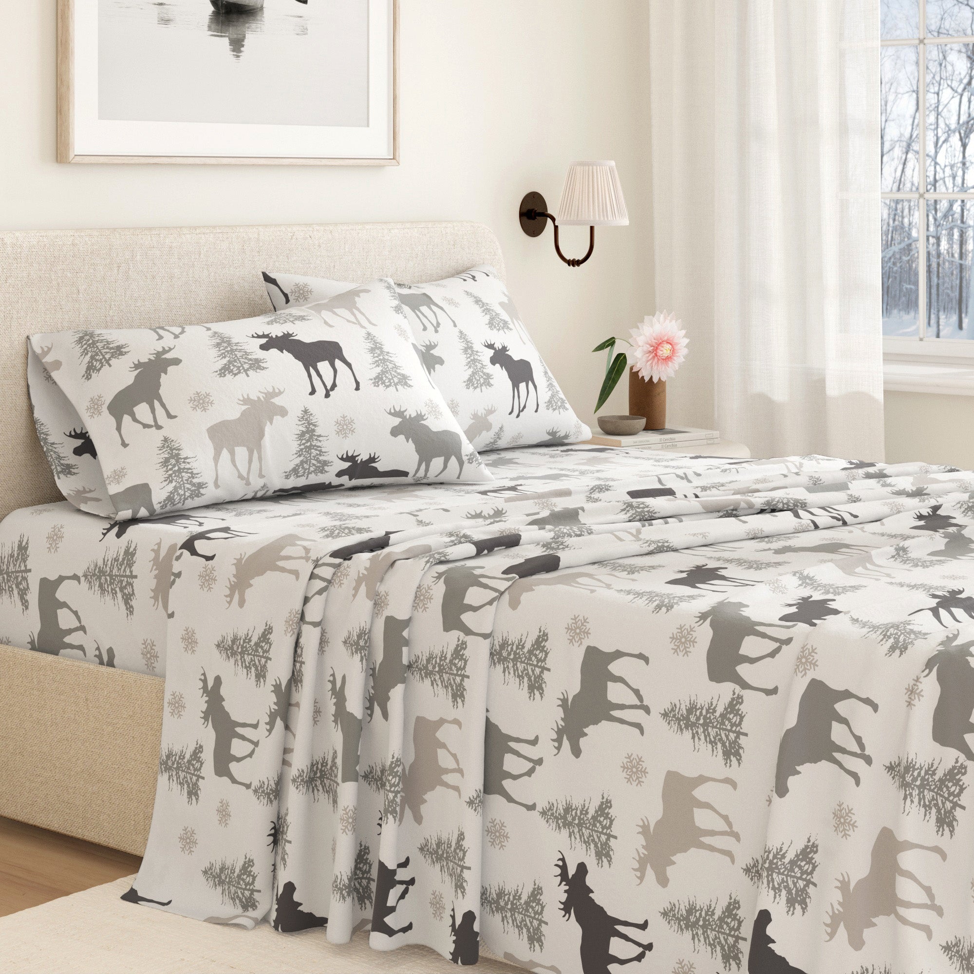 Bed with moose patterned bedding in a bedroom setting