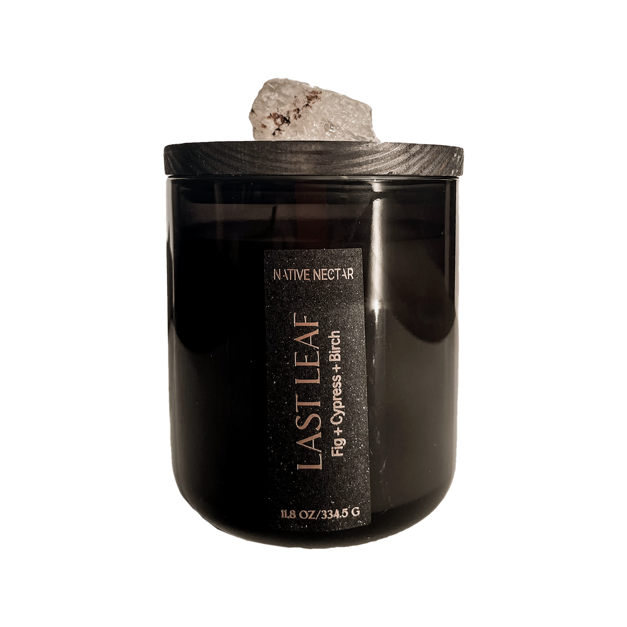 Black candle with wooden lid labeled 'Last Leaf' on a white background