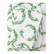 Floral patterned fabric with green leaves and white background