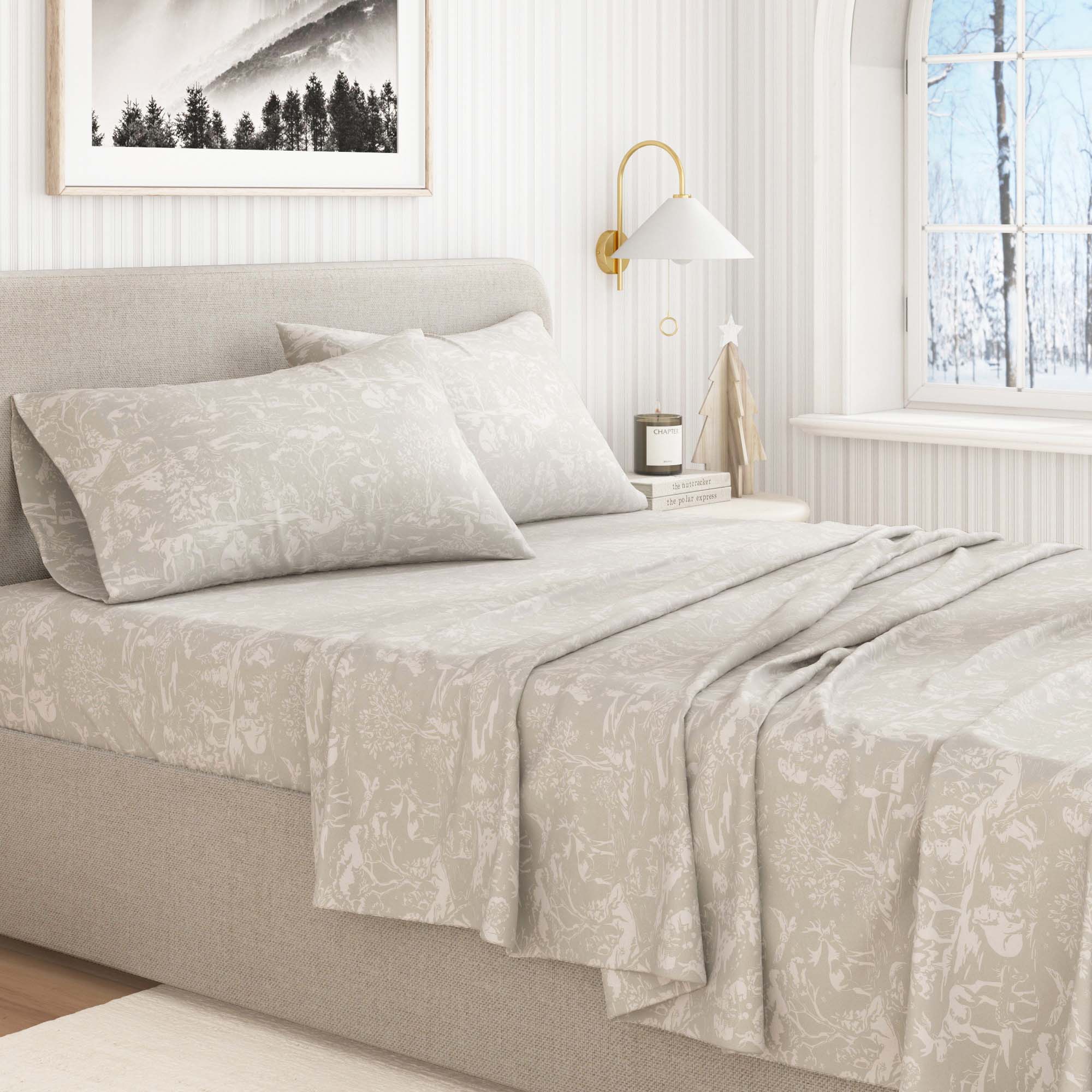 Neatly made bed with light-colored bedding in a bedroom setting.