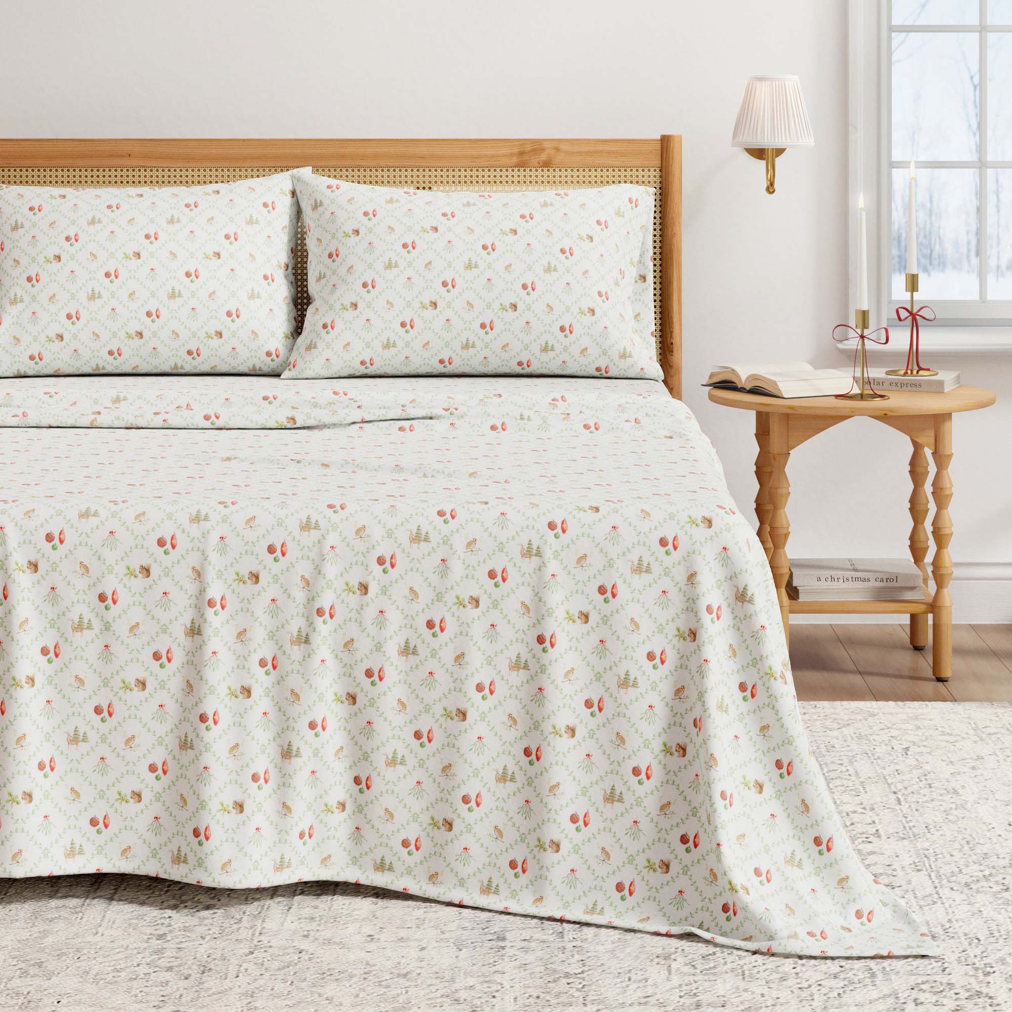 Floral patterned bedspread on a bed with a wooden headboard and side table.