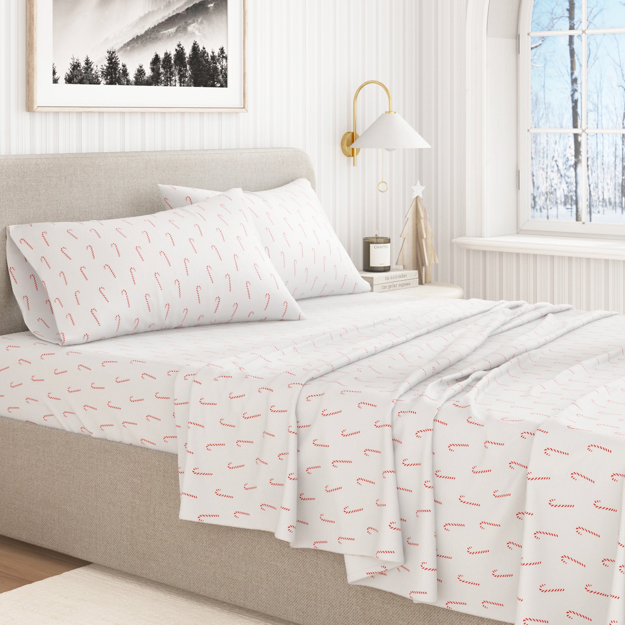 Bed with white bedding featuring red patterns in a bedroom setting.