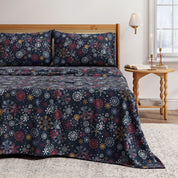 Bed with floral-patterned bedding in a bedroom setting