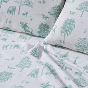 Sheet set with green forest animals and trees pattern on gray background