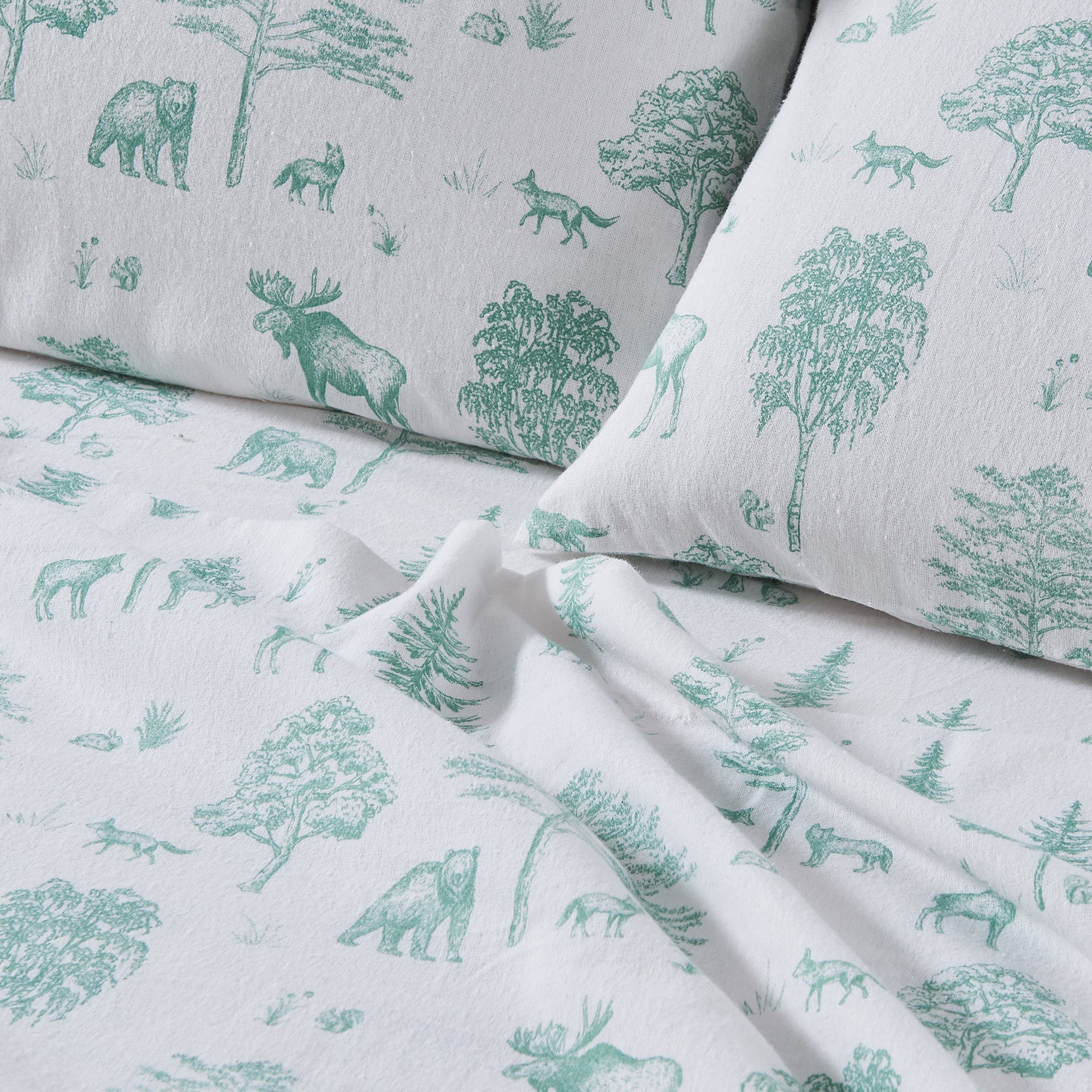 Sheet set with green forest animals and trees pattern on gray background