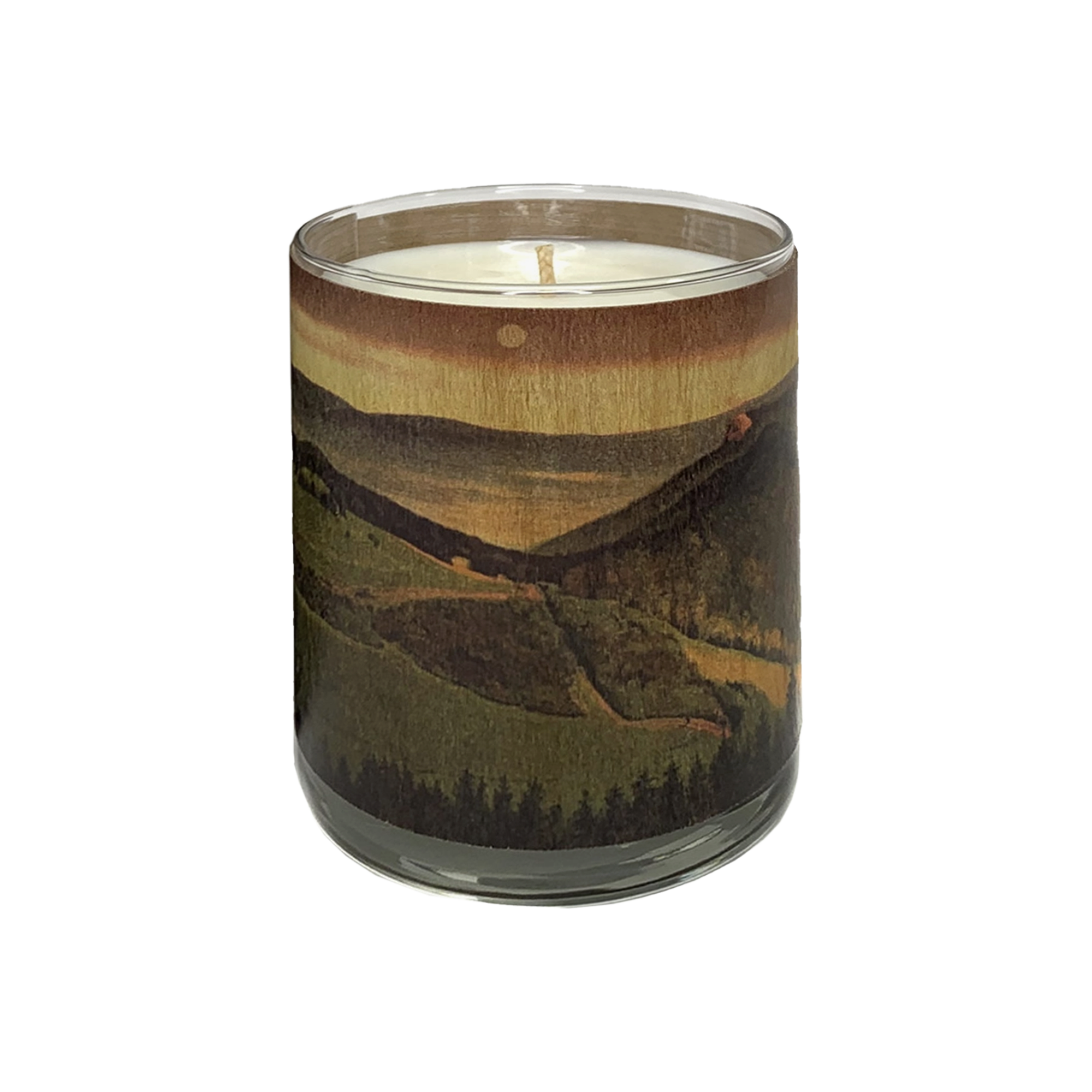 Candle in a glass jar with a mountain landscape design on a white background