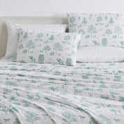 Bedding set with green forest and animal pattern on white background