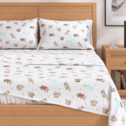 Bed with cartoon sloth patterned bedding in a bedroom setting