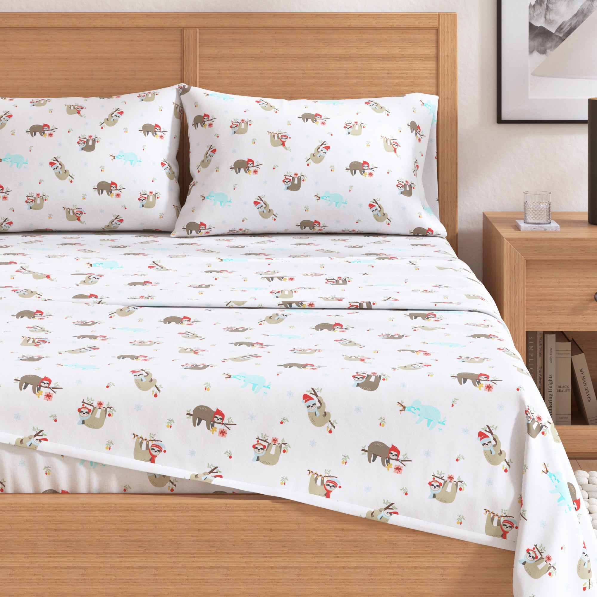 Bed with cartoon sloth patterned bedding in a bedroom setting