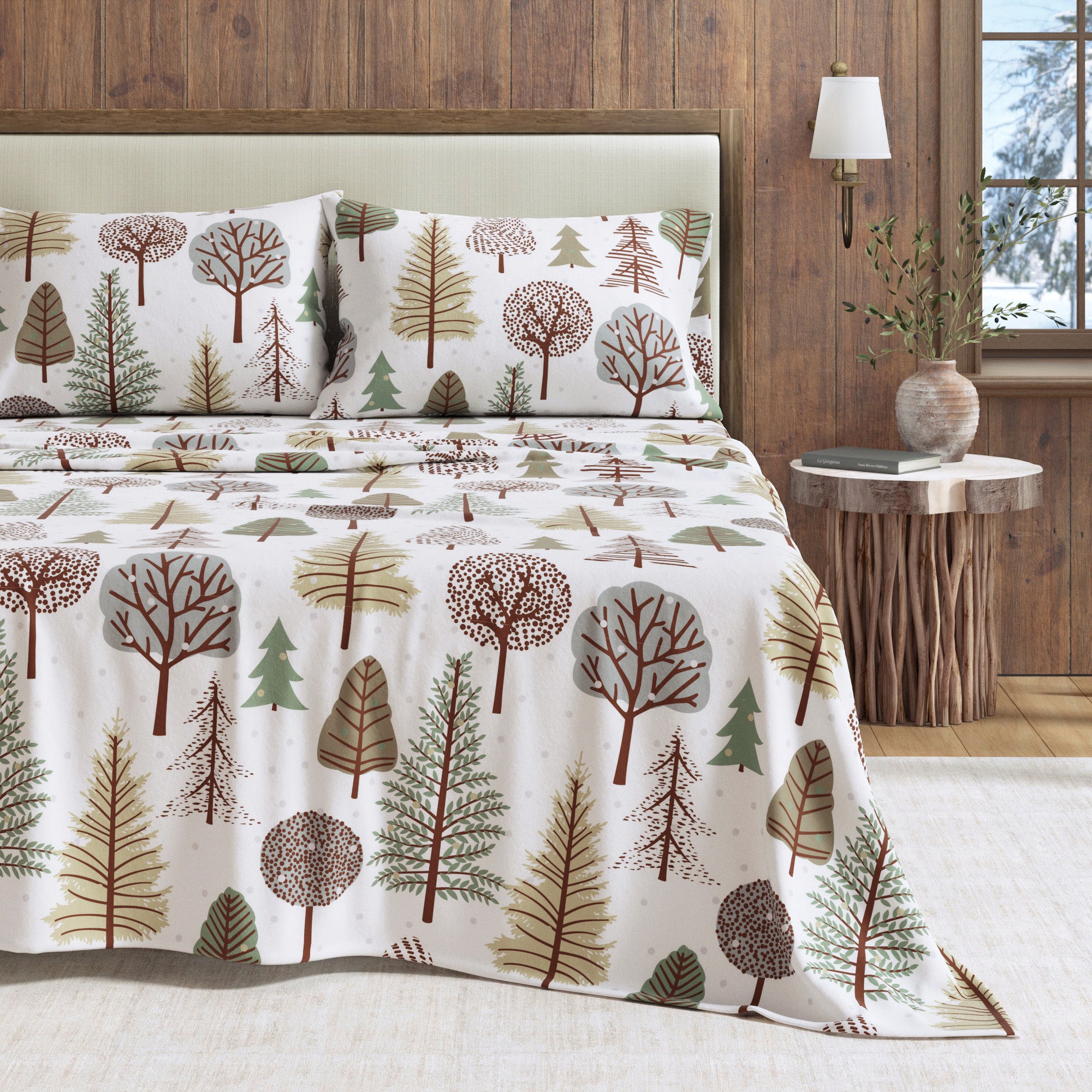 Bedding set with tree pattern on a bed in a bedroom setting.