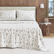 Bed with patterned bedding in a bedroom setting