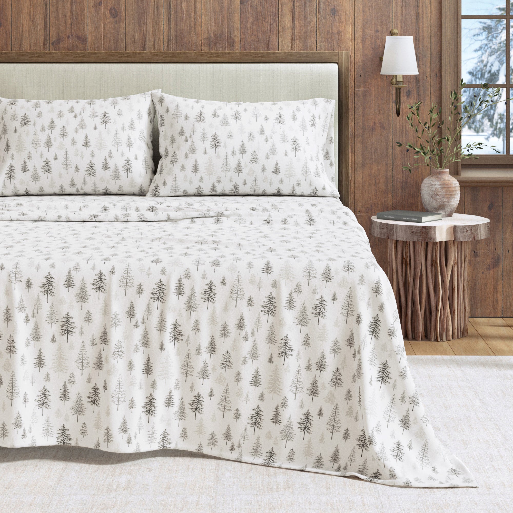 Bed with patterned bedding in a bedroom setting