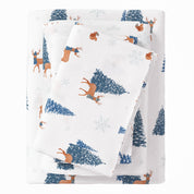 Folded fabric with deer and tree pattern on a white background