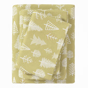 Folded green fabric with white leaf pattern on a white background
